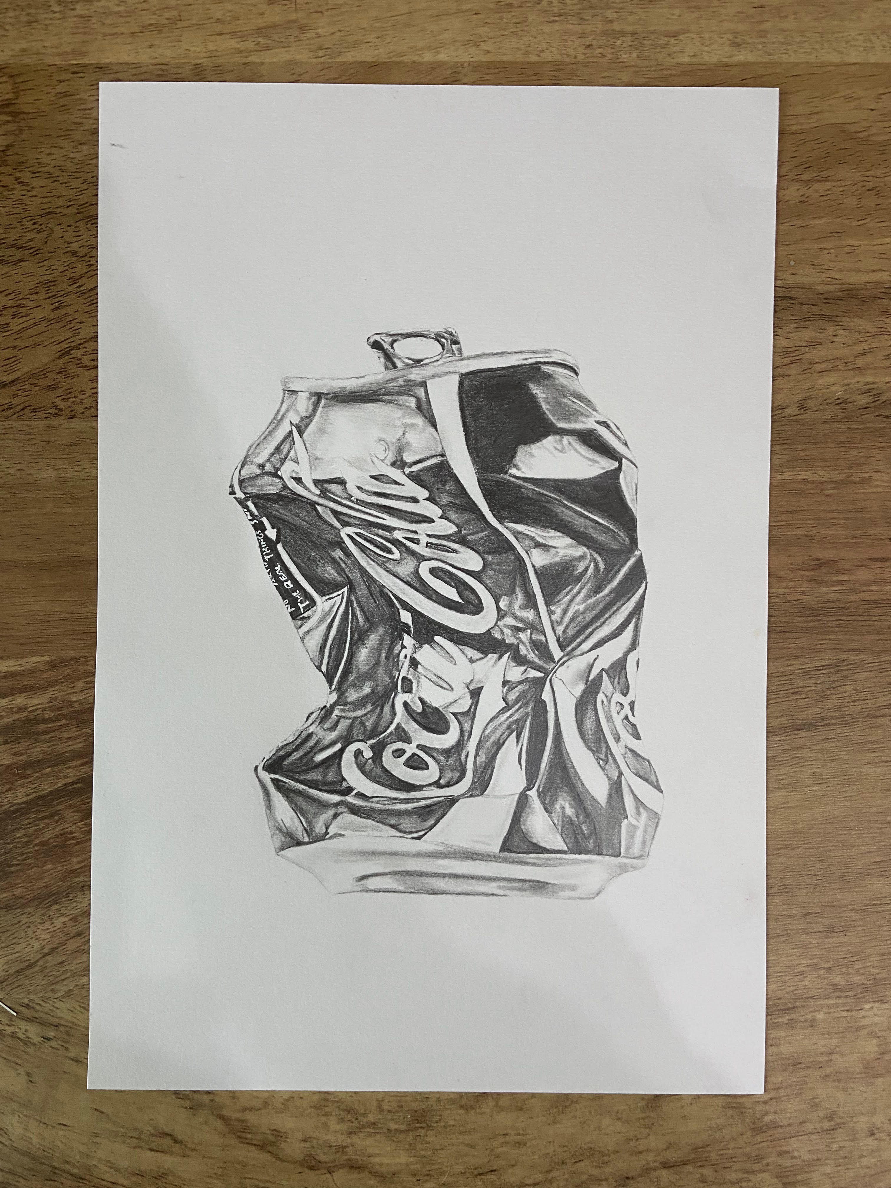Pencil drawing of a crushed CocaCola can
